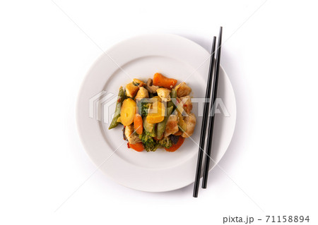 Stir fry chicken with vegetables isolated on white background Stir fry chicken with vegetables isolated on white background 71158894