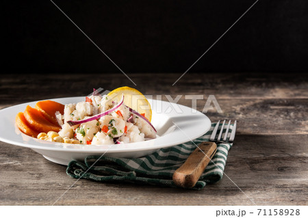 Traditional peruvian ceviche with fish, sweet potato, corn and vegetables Traditional peruvian ceviche with fish, sweet potato, corn and vegetables 71158928