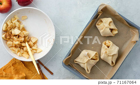 Puff pastry with apples, sugar and cinnamon. Autumn pastries. Puff pastry with apples, sugar and cinnamon. Autumn pastries. 71167064