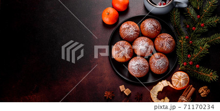Beautiful delicious fresh cocoa muffins on the Christmas table 71170234
