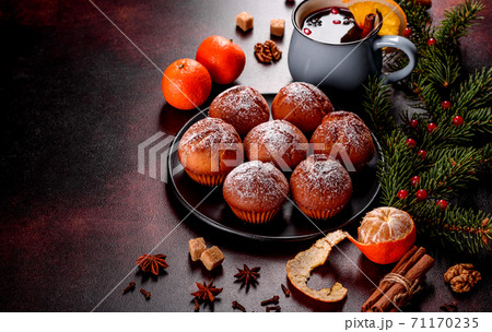 Beautiful delicious fresh cocoa muffins on the Christmas table 71170235