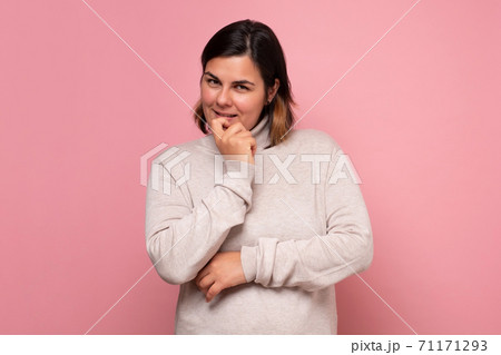 Portrait of a smiling thinking woman making a plan. 71171293
