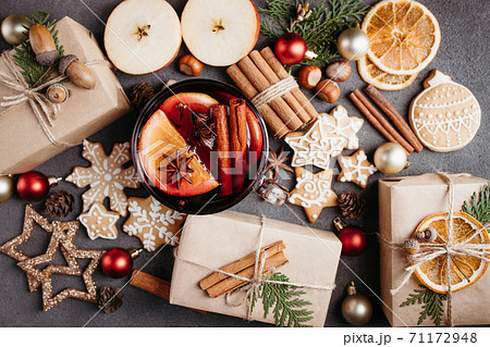 Holiday background with mulled wine and gift boxes Holiday background with mulled wine and gift boxes 71172948