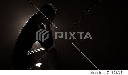 Body shape of woman as silhouette expression sad, cry and loneliness Body shape of woman as silhouette expression sad, cry and loneliness 71178354