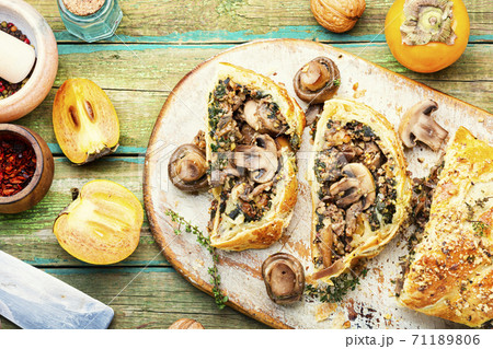 Sliced pie with mushrooms 71189806