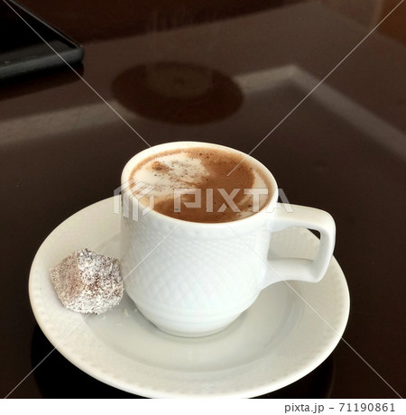 Turkish coffee with milk and traditional sweet delight 71190861