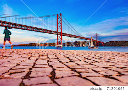 Places of interest in Lisbon, Portugal. Bridge of April 25 and sunset 71201065