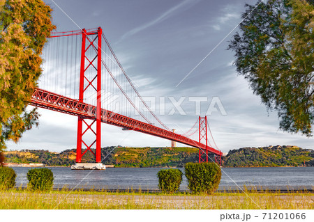 Places of interest in Lisbon, Portugal. Bridge of April 25 and sunset 71201066