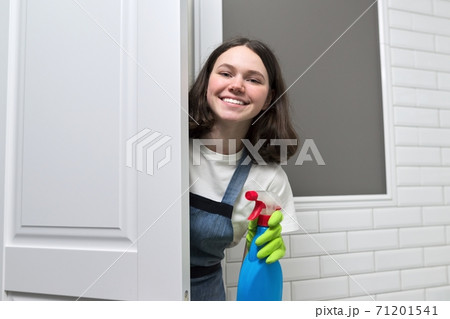 Portrait of girl doing cleaning in bathroom 71201541