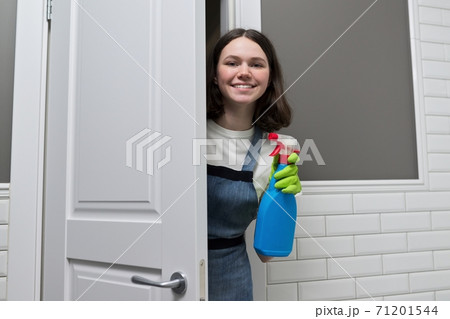 Portrait of girl doing cleaning in bathroom Portrait of girl doing cleaning in bathroom 71201544