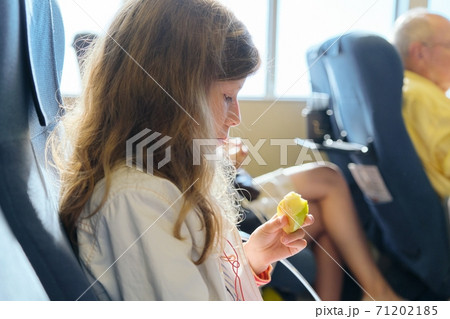 Passenger shipping, girl child with family sitting in cabin comfortable sea ferry 71202185