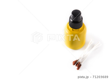 Medical iodine in a bottle and gauzes isolated on white background. Medical iodine in a bottle and gauzes isolated on white background. 71203689