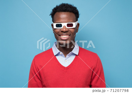 African american man in 3D glasses watching interesting movie on screen 71207798