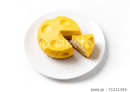 Flat lay shot of cheesecake on plate on white background 71221304