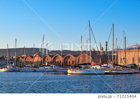 Sunrise in Old Venetian port, Chania, Crete, Greece. Sailing boats, yachts, pier, Old Venetian shipyard. Bell tower of Greek church, Cretan mountains Sunrise in Old Venetian port, Chania, Crete, Greece. Sailing boats, yachts, pier, Old Venetian shipyard. Bell tower of Greek church, Cretan mountains 71225404