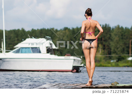 Fit hot woman taking off swimsuit pantiesの写真素材 [71225874] - PIXTA