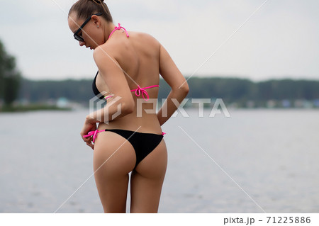 Fit hot woman taking off swimsuit pantiesの写真素材 [71225886] - PIXTA