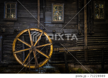 Fragment of the wall of a building with a water mill 71228989