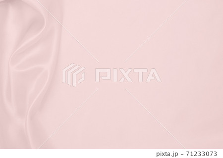 Smooth elegant pink silk or satin texture as wedding background. Luxurious background design Smooth elegant pink silk or satin texture as wedding background. Luxurious background design 71233073