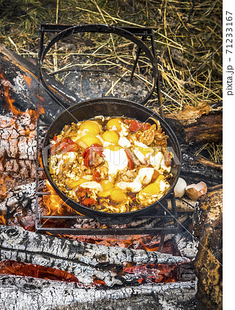 Omelet with tomatoes on an open fire in a tourist camp Omelet with tomatoes on an open fire in a tourist camp 71233167