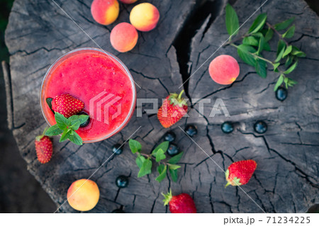 Blended Colorful Strawberry Apricot Sugar Free Smoothie with Chia Seeds and Mint 71234225