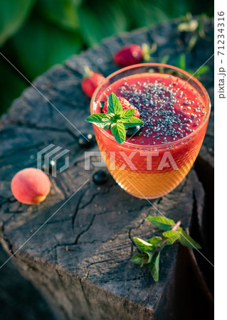 Blended Colorful Strawberry Apricot Sugar Free Smoothie with Chia Seeds and Mint 71234316