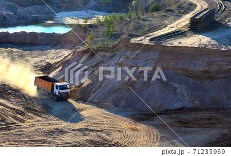 Mining dump truck transports sand and other minerals in the quarry. 71235969