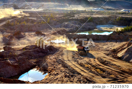 Mining dump truck transports sand and other minerals in the quarry. 71235970
