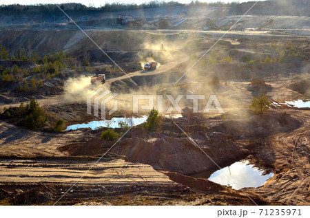 Mining dump truck transports sand and other minerals in the quarry. 71235971