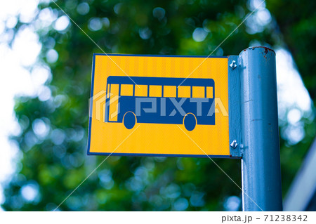Bus stop sign on a metal pole Bus stop sign on a metal pole 71238342