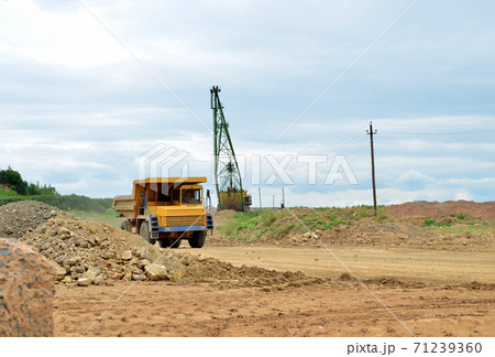 Big mining truck transport of minerals in the quarry. Big mining truck transport of minerals in the quarry. 71239360