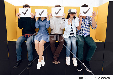 Admired girl looks into virtual reality glasses. Admired girl looks into virtual reality glasses. 71239926