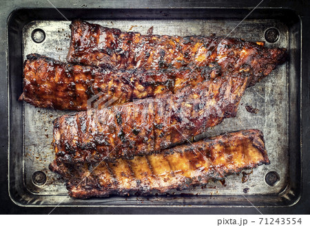 Barbecue spare ribs St Louis style with hot honey chili marinade 71243554