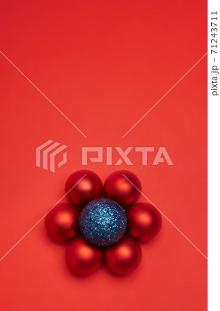New Year's toy hovering in the air on a red background 71243711