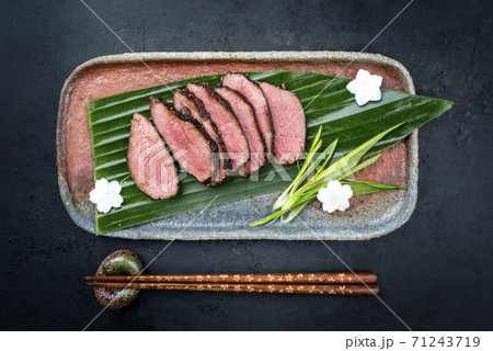 dry aged fillet steak sliced with daikon and leek 71243719