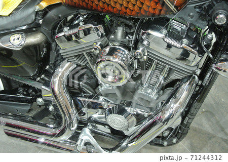 SERDANG, MALAYSIA -JULY 29, 2017: Chopper type motorcycle engine. Miscellaneous design of v-twin engine powered with different horsepower. SERDANG, MALAYSIA -JULY 29, 2017: Chopper type motorcycle engine. Miscellaneous design of v-twin engine powered with different horsepower. 71244312