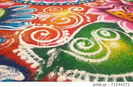 KUALA LUMPUR, MALAYSIA -OCTOBER 16, 2016: Rangoli. Colorful pattern made with colored rice, lentils and powder during Diwali, Hindu New Years and the Hindu Festival of Light.  71244371