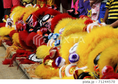 SEREMBAN, MALAYSIA -FEBRUARY 2, 2017: Chinese lion mask or lion head used to performed lion dance during Chinese New Year Festival at Seremban, Malaysia. Beautiful & colourful. SEREMBAN, MALAYSIA -FEBRUARY 2, 2017: Chinese lion mask or lion head used to performed lion dance during Chinese New Year Festival at Seremban, Malaysia. Beautiful & colourful. 71244570
