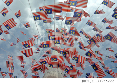 SELANGOR, MALAYSIA -AUGUST 31, 2017: Selective focused small size Malaysia flag tie in large quantities in windy air.  71245777