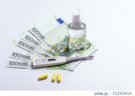 tablets and a thermometer on the table. protection from the virus tablets and a thermometer on the table. protection from the virus 71253414