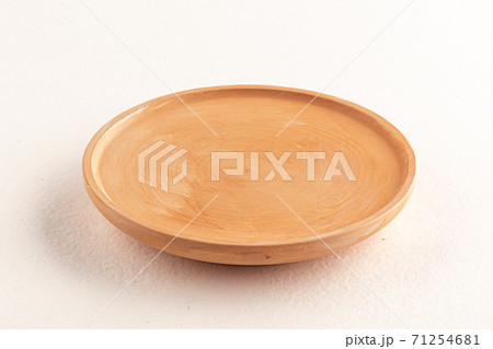Beige wooden plate isolated on the white Beige wooden plate isolated on the white 71254681
