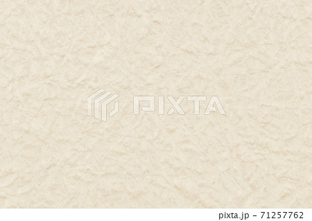 ざらざらでこぼこなベージュの紙テクスチャの写真素材