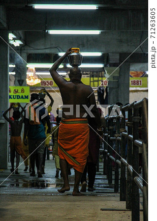 Buddhist monk walking to the temple in Bangkok 71263605