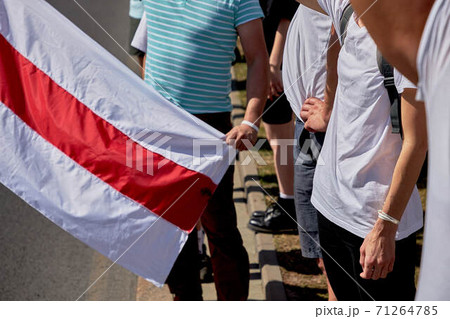 Peaceful demonstration against violence when a man with a white ribbon on his arm 71264785
