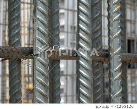 SEREMBAN, MALAYSIA -AUGUST 05, 2017: Steel reinforcement bar used to reinforced concrete at the construction site. It was tied together using tiny wires. SEREMBAN, MALAYSIA -AUGUST 05, 2017: Steel reinforcement bar used to reinforced concrete at the construction site. It was tied together using tiny wires. 71265126