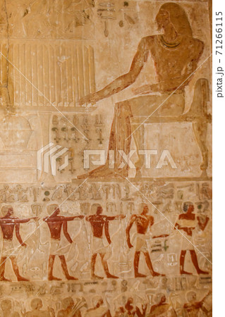 Ancient egyptian paintings and hieroglyphs carved on the stone wall Ancient egyptian paintings and hieroglyphs carved on the stone wall 71266115
