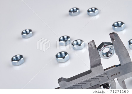 Close-up vernier calipers with clenched metal nut. Close-up vernier calipers with clenched metal nut. 71271169