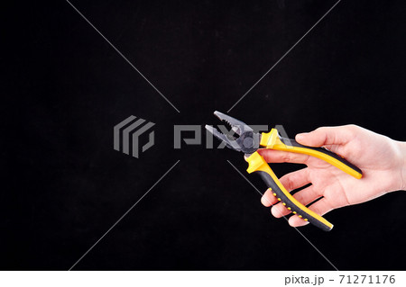 Pliers in the hand. Pliers in the hand. 71271176