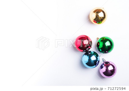 Christmas New Year composition. Gifts, colorful ball decorations on white background. Winter holidays concept. Flat lay, top view, copy space 71272594
