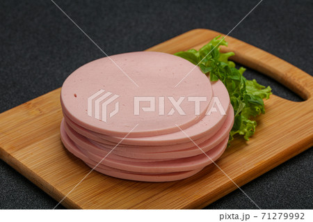Sliced pork natural sausages over board 71279992